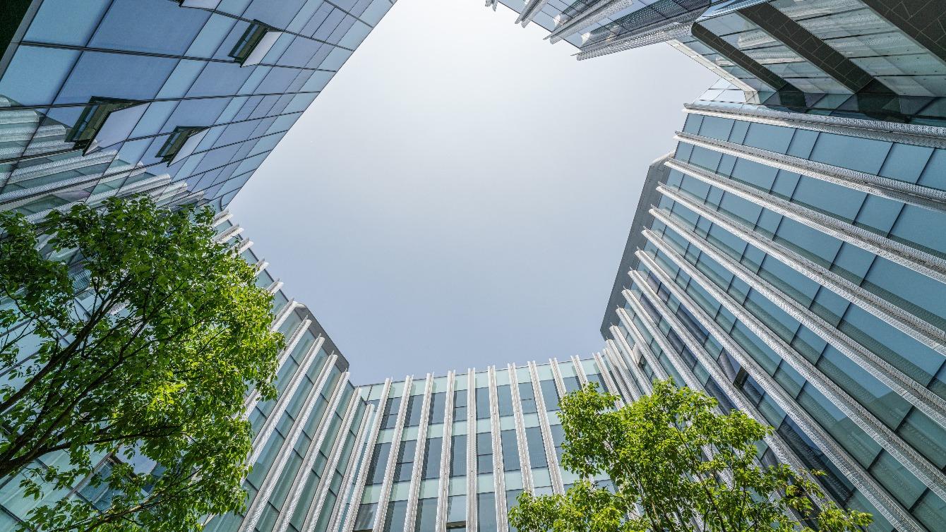 Updards view of sky through office buildings